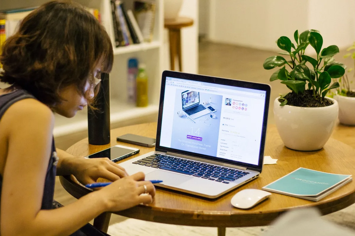 Virtual assistant working on digital marketing campaigns from a home office with a laptop