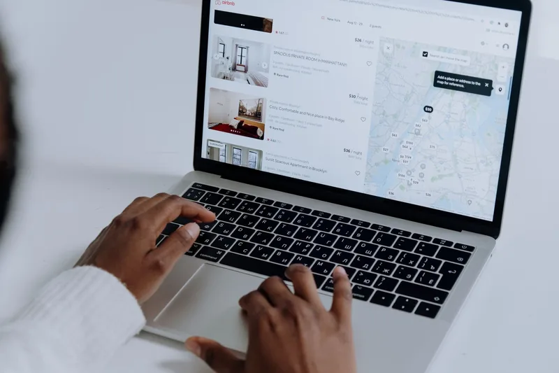 Hands typing on a laptop keyboard, representing the search for freelance ecommerce VA client opportunities online