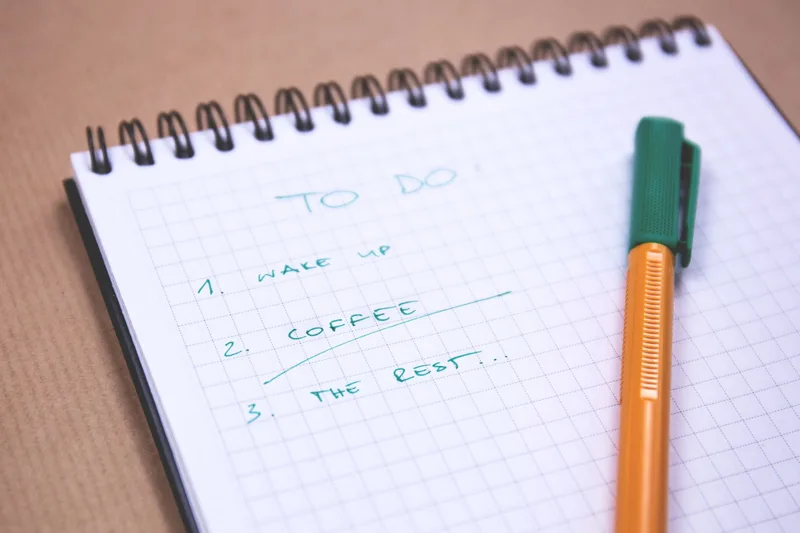 Handwritten to-do checklist on a notepad, representing the self-practice plan a new VA can follow before landing a client