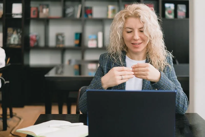 Person on a video call conducting a job interview from a laptop