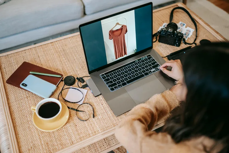 Remote worker at a home desk with a laptop open, working on ecommerce virtual assistant tasks