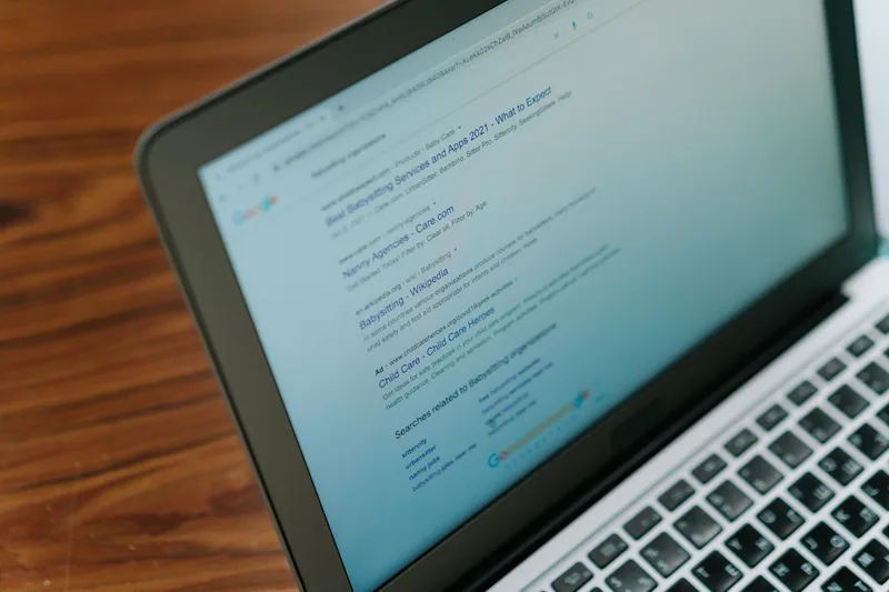 Laptop screen showing virtual assistant job listings on a remote work platform