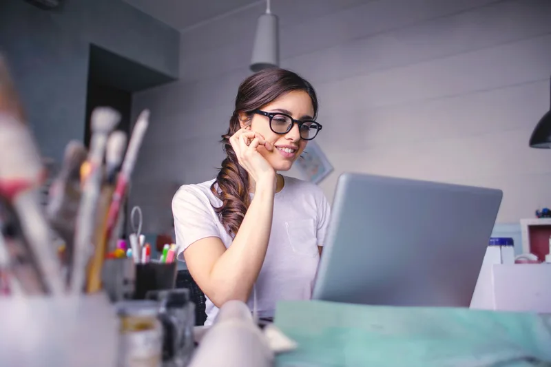 Happy virtual assistant celebrating a successful first week working remotely from home