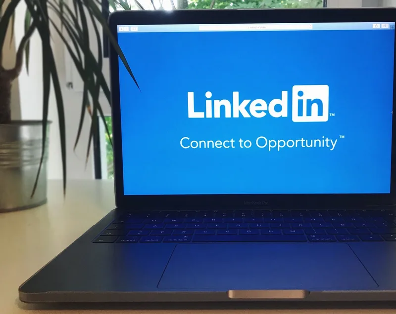 Laptop screen displaying a professional job platform, one of the online portals VAs use to find work
